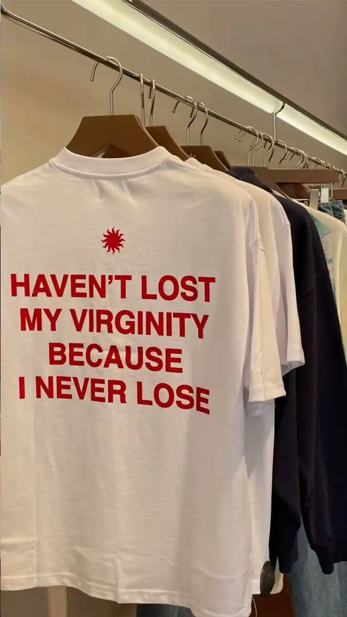 Trendy Women’s White Graphic Tee – “Haven’t Lost My Virginity Because I Never Lose” Funny Statement Shirt